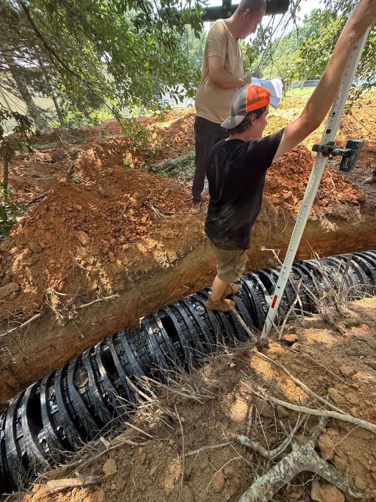 Drainfield installation work being carried out during a residential septic system project