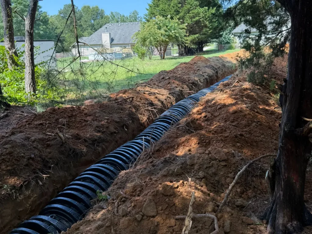 Drainfield installation in progress at a residential site
